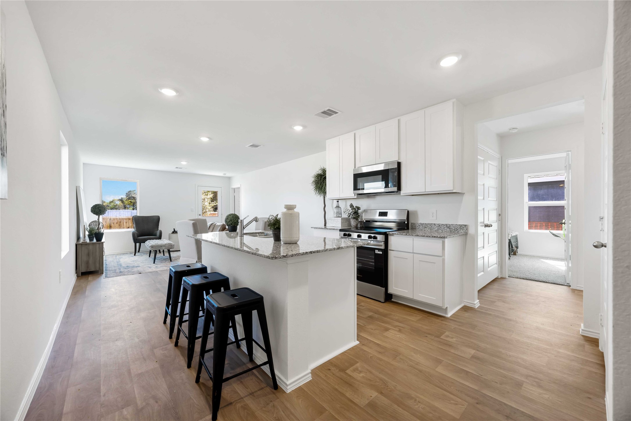 11910 Lilac Ice Lane Houston, TX 77048 - Photo 3 of 17 a kitchen with a sink a counter top space stainless steel appliances and cabinets