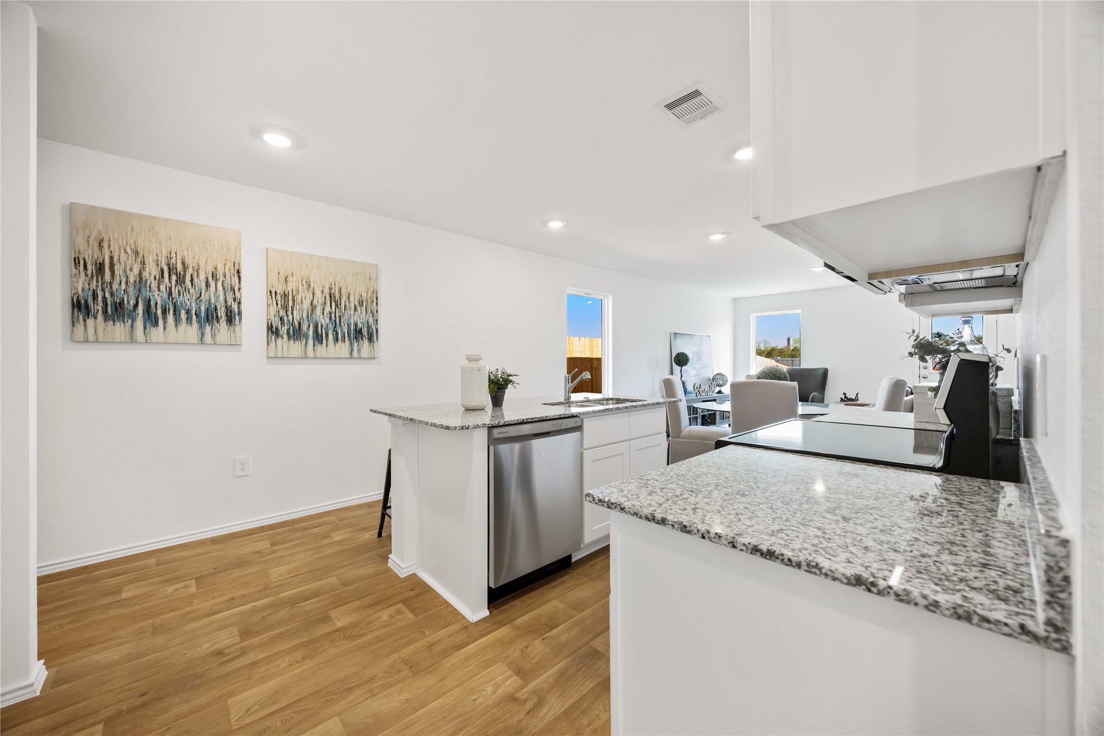 11910 Lilac Ice Lane Houston, TX 77048 - Photo 7 of 17 a view of living room with furniture and kitchen view