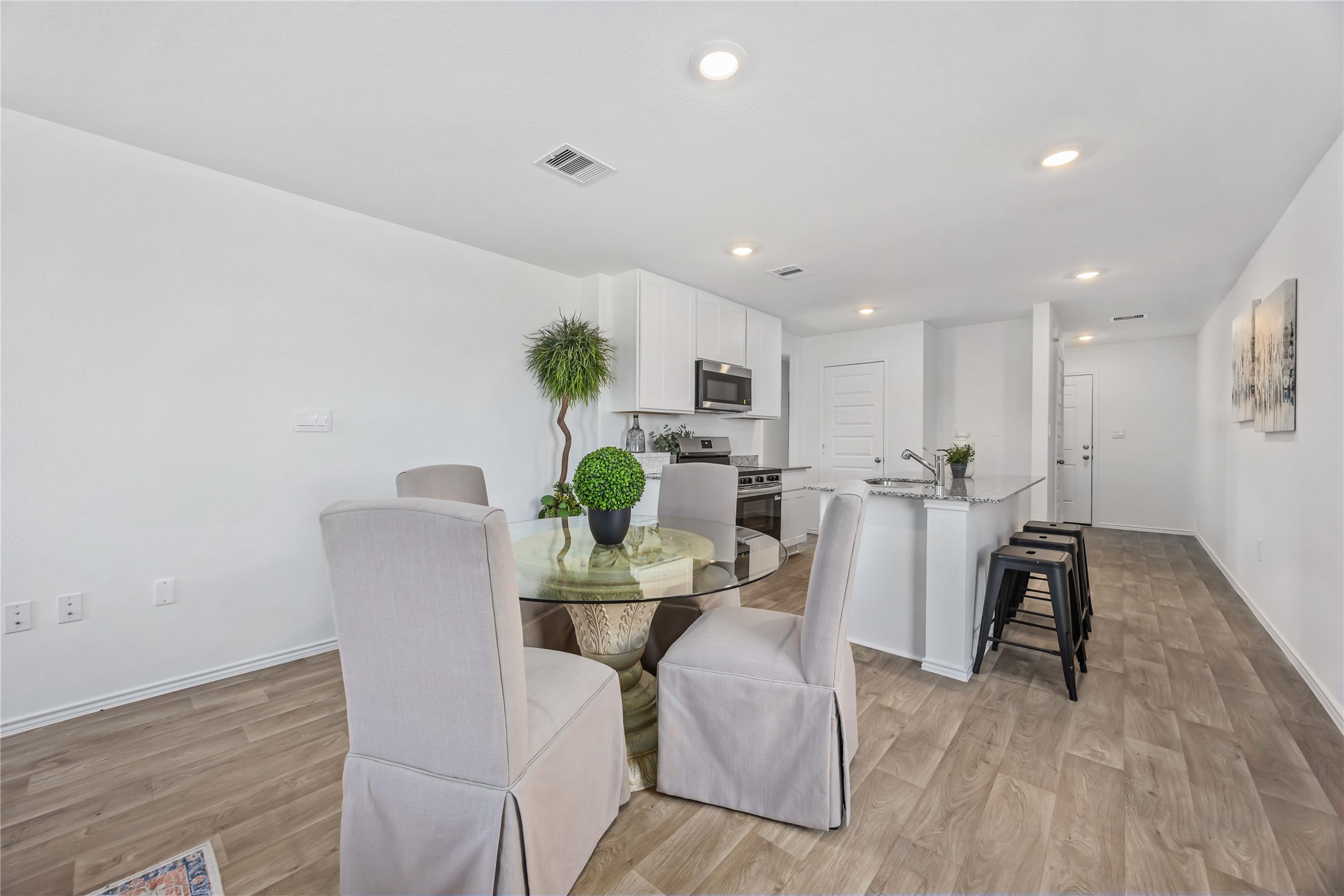 11910 Lilac Ice Lane Houston, TX 77048 - Photo 8 of 17 a view of a dining room with furniture and wooden floor