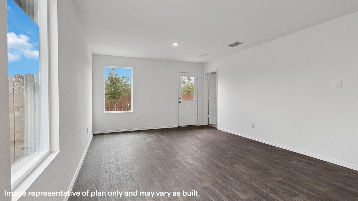 11910 Lilac Ice Lane Houston, TX 77048 - Photo 9 of 17 a view of an empty room with wooden floor and a window
