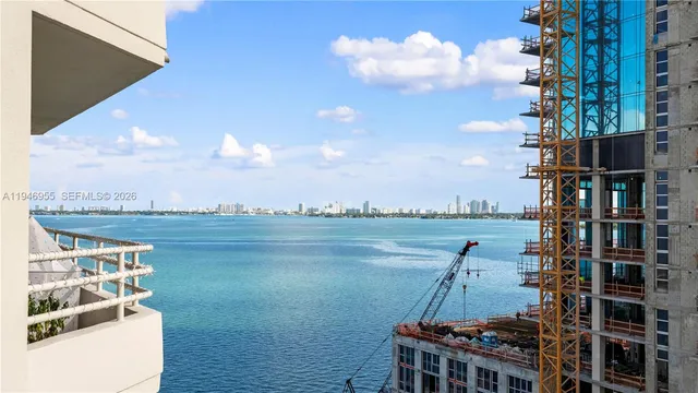 a bathroom with a sink mirror vanity and toilet
