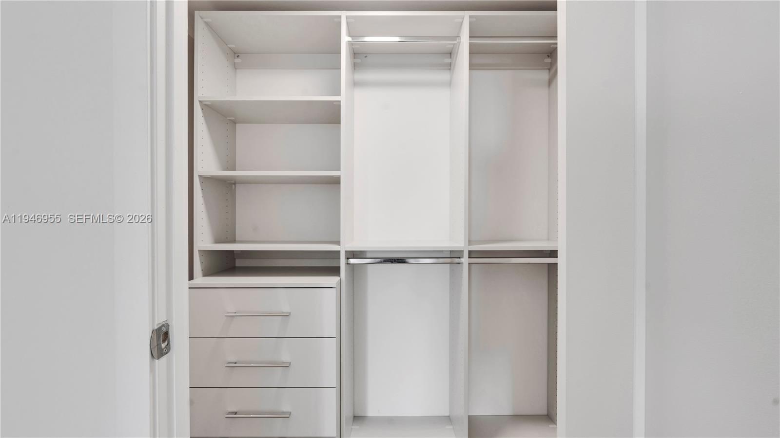 555 Northeast 34th Street, Unit 1509 Miami, FL 33137 - Photo 24 of 32 a view of an empty walk in closet