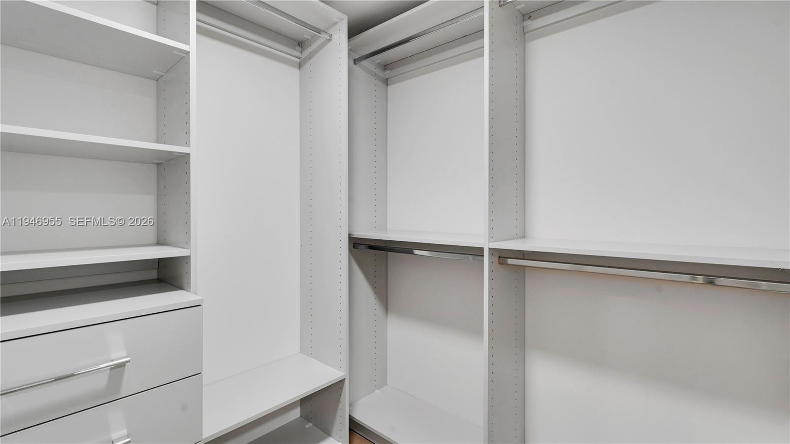 555 Northeast 34th Street, Unit 1509 Miami, FL 33137 - Photo 30 of 32 a view of an empty walk in closet