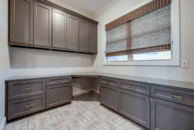 a kitchen with stainless steel appliances granite countertop cabinets and window