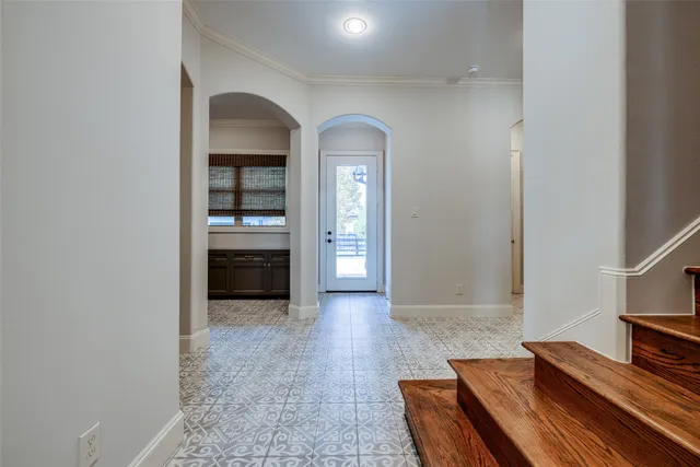 wooden floor in a hall with a window
