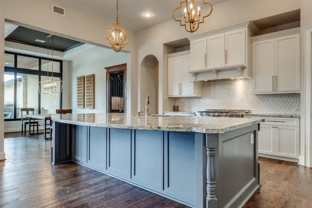 an aerial view of residential houses with outdoor space and river