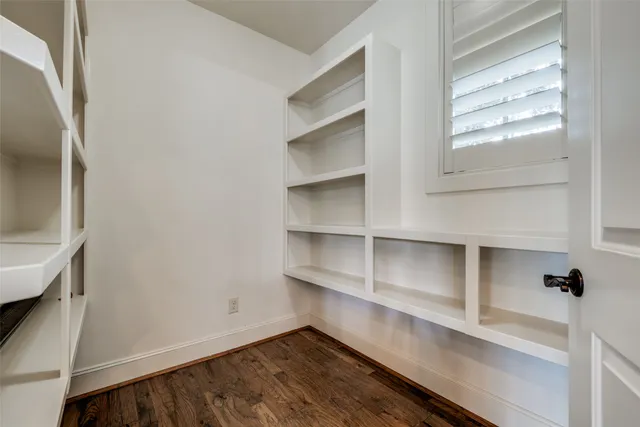 a view of a room with a table and chairs