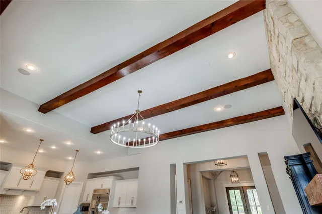 a view of walk in closet with windows