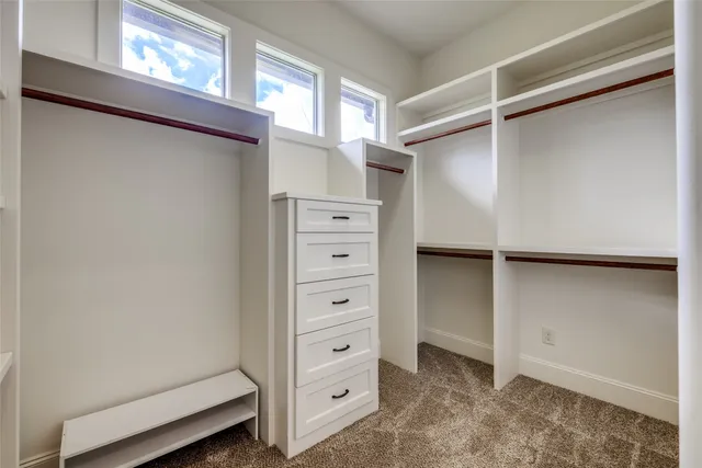 a view of swimming pool with outdoor seating and plants