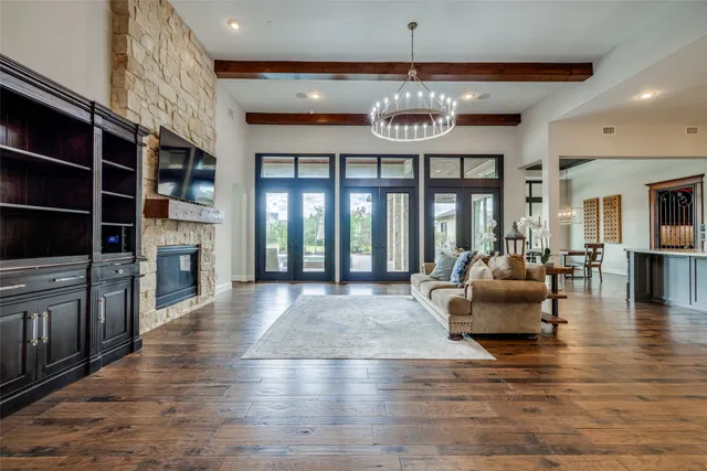 a view of an dining room with furniture window and wooden floor