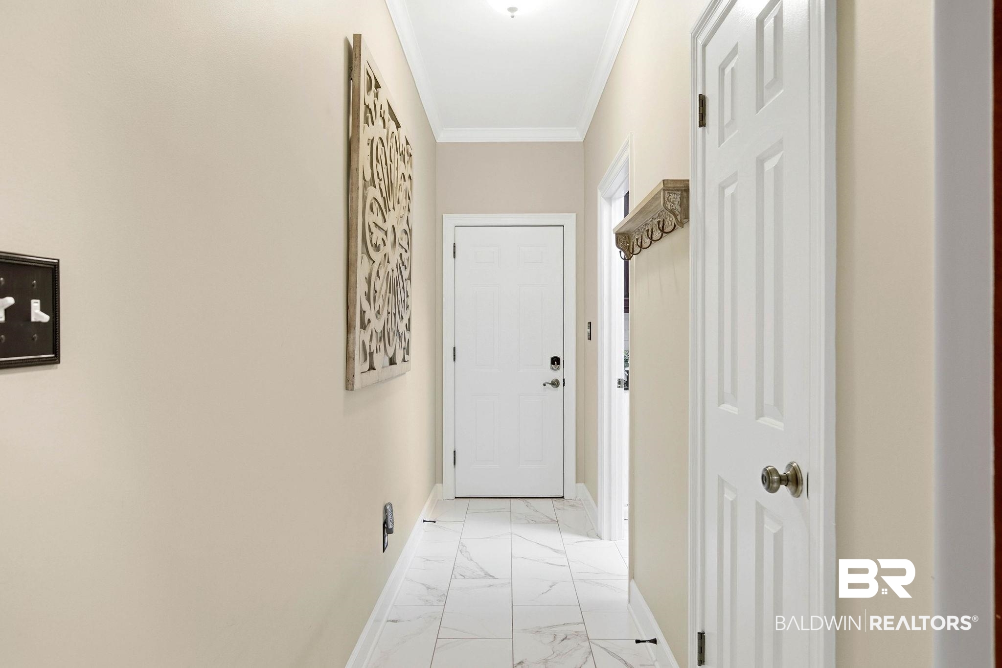 31515 Rhett Drive Spanish Fort, AL 36527 - Photo 22 of 100 Hallway to the Garage from the Kitchen and Great room downstairs laundry room.