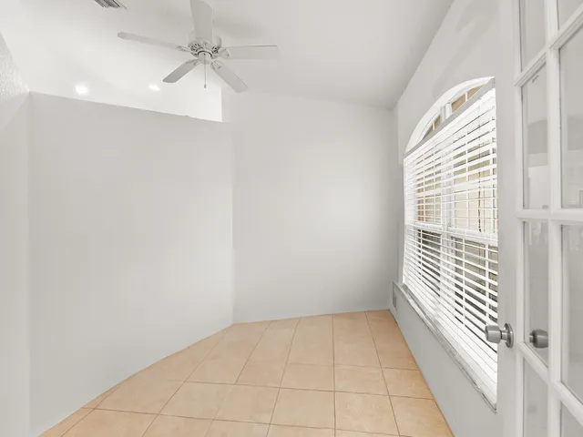 en empty room with windows