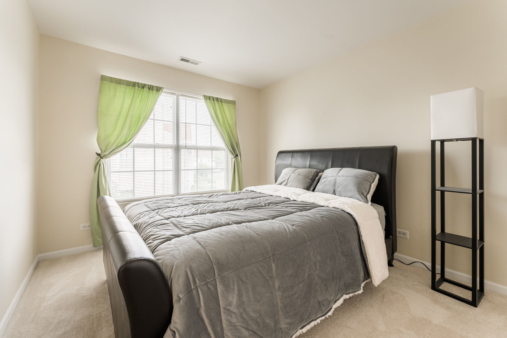 1936 West Cobblestone Road Romeoville, IL 60446 - Photo 17 of 25 a bedroom with a bed and a large window