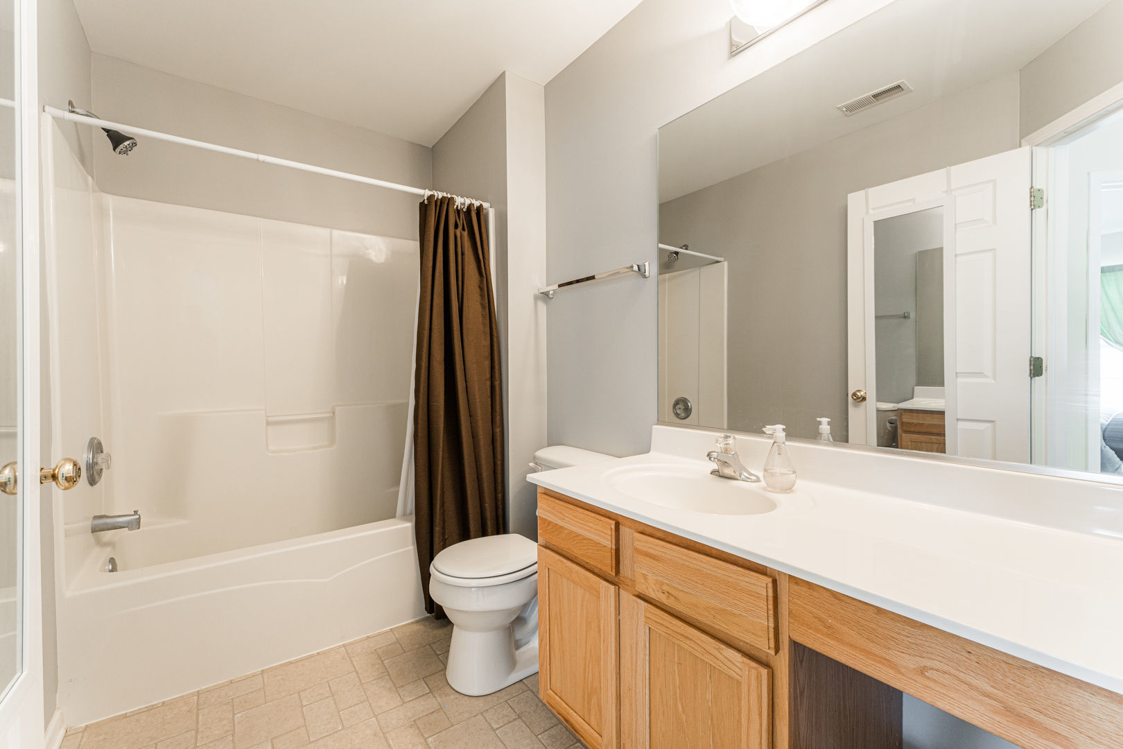 1936 West Cobblestone Road Romeoville, IL 60446 - Photo 18 of 25 a bathroom with a sink mirror toilet and bathtub