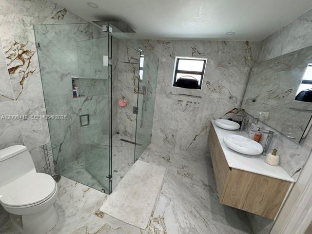 18781 Southwest 294th Terrace Homestead, FL 33030 - Photo 16 of 44 a bathroom with a sink toilet and shower