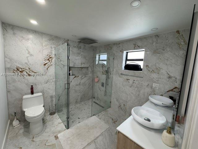 18781 Southwest 294th Terrace Homestead, FL 33030 - Photo 17 of 44 a bathroom with a toilet sink and shower