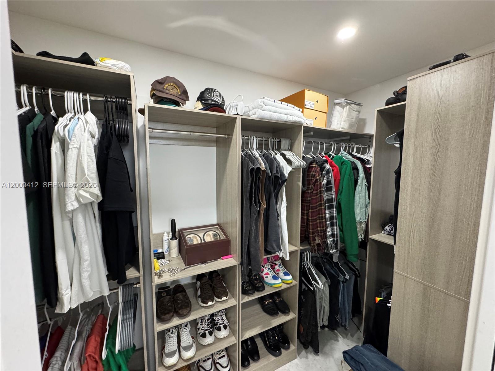 18781 Southwest 294th Terrace Homestead, FL 33030 - Photo 18 of 44 a view of walk in closet with clothes and shoes