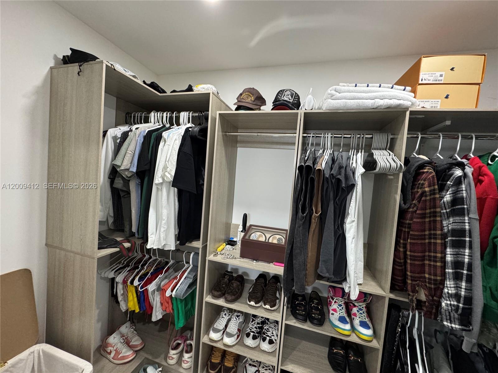 18781 Southwest 294th Terrace Homestead, FL 33030 - Photo 19 of 44 a view of walk in closet with clothes and shoes