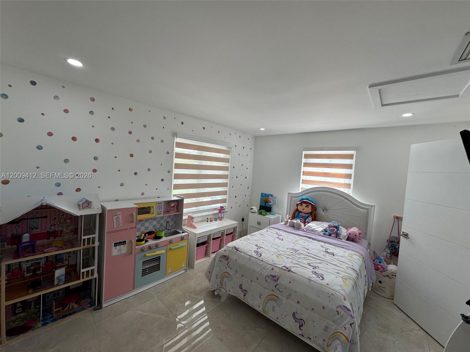 18781 Southwest 294th Terrace Homestead, FL 33030 - Photo 22 of 44 a bedroom with a bed and a window