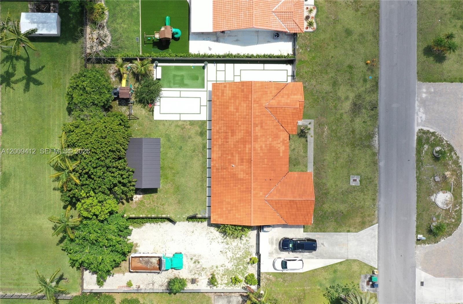 18781 Southwest 294th Terrace Homestead, FL 33030 - Photo 3 of 44 an aerial view of residential houses with outdoor space