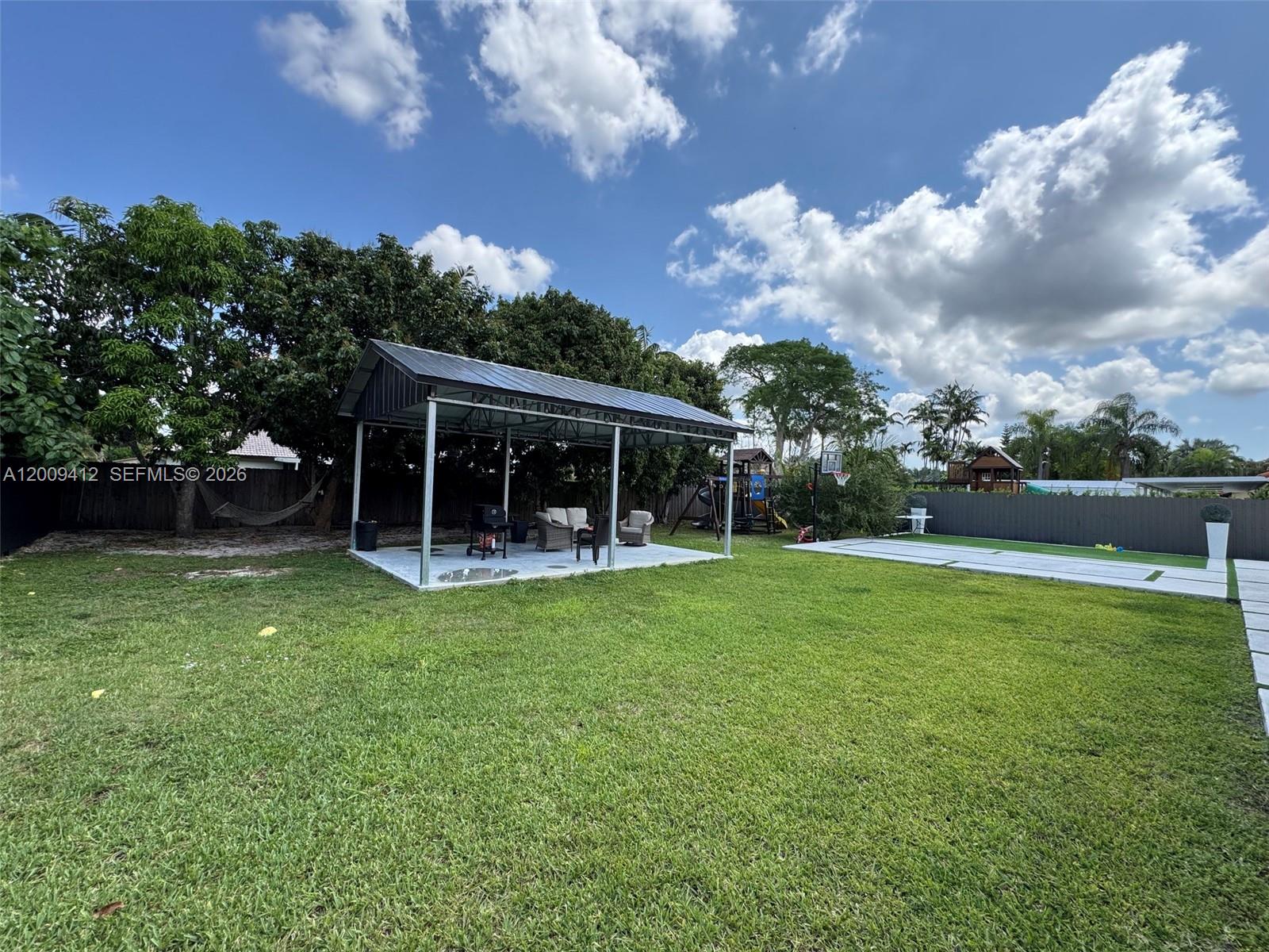 18781 Southwest 294th Terrace Homestead, FL 33030 - Photo 37 of 44 a view of house with backyard space and garden