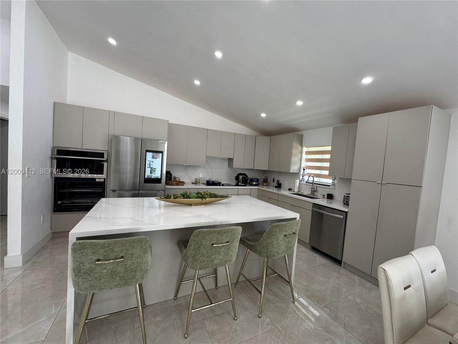 18781 Southwest 294th Terrace Homestead, FL 33030 - Photo 10 of 44 a large kitchen with a table and chairs