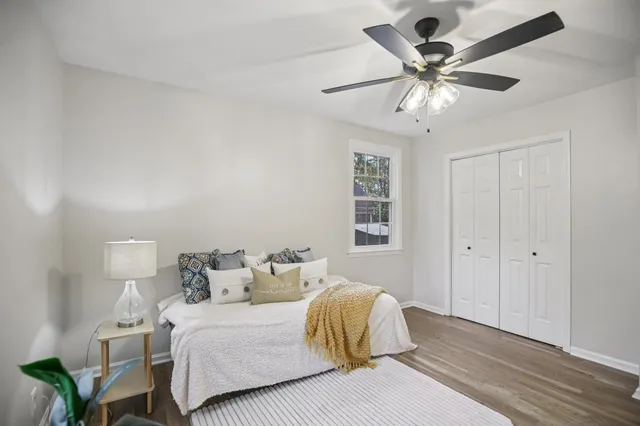 a bedroom with a bed and a chandelier