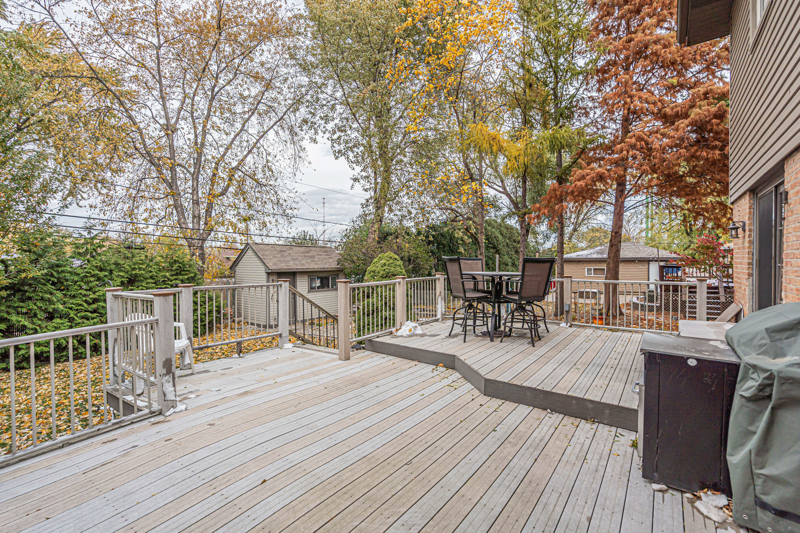 6528 Ridge Drive Chicago Ridge, IL 60415 - Photo 31 of 33 a view of a house with wooden deck and furniture
