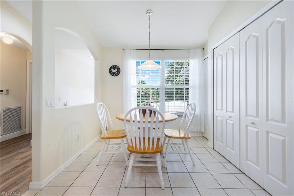 9331 Spring Run Boulevard, Unit 3003 Estero, FL 34135 - Photo 16 of 47 a view of a dining room with furniture window and outside view