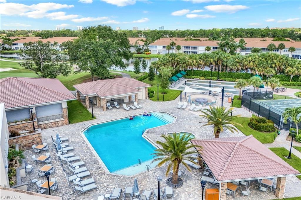9331 Spring Run Boulevard, Unit 3003 Estero, FL 34135 - Photo 2 of 47 an aerial view of a house with swimming pool garden and patio