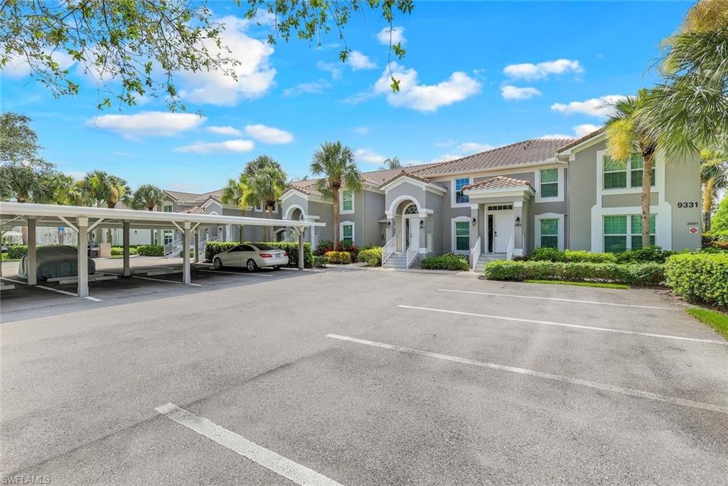 9331 Spring Run Boulevard, Unit 3003 Estero, FL 34135 - Photo 27 of 47 a view of a street with cars