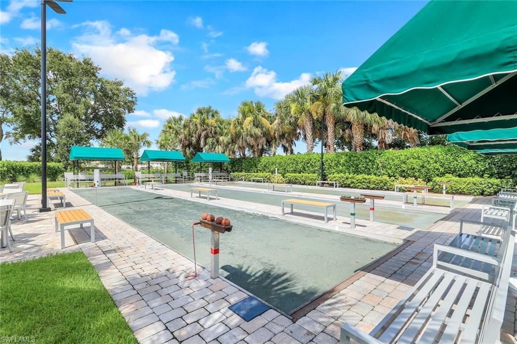 9331 Spring Run Boulevard, Unit 3003 Estero, FL 34135 - Photo 29 of 47 a view of swimming pool with outdoor seating and plants