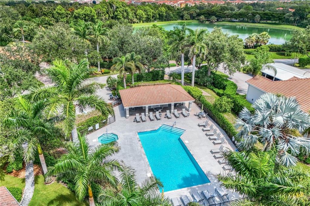 9331 Spring Run Boulevard, Unit 3003 Estero, FL 34135 - Photo 43 of 47 a view of a swimming pool with a patio