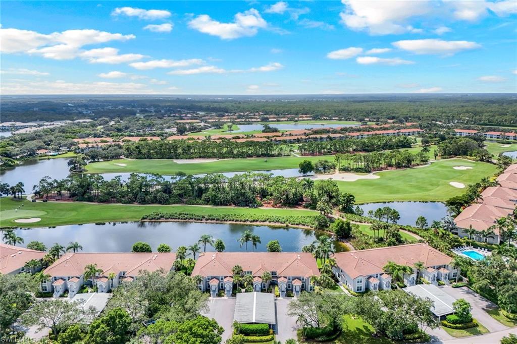 9331 Spring Run Boulevard, Unit 3003 Estero, FL 34135 - Photo 45 of 47 an aerial view of a city with lots of residential buildings and ocean view in back