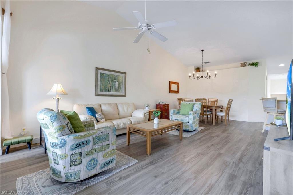 9331 Spring Run Boulevard, Unit 3003 Estero, FL 34135 - Photo 6 of 47 a living room with furniture and wooden floor