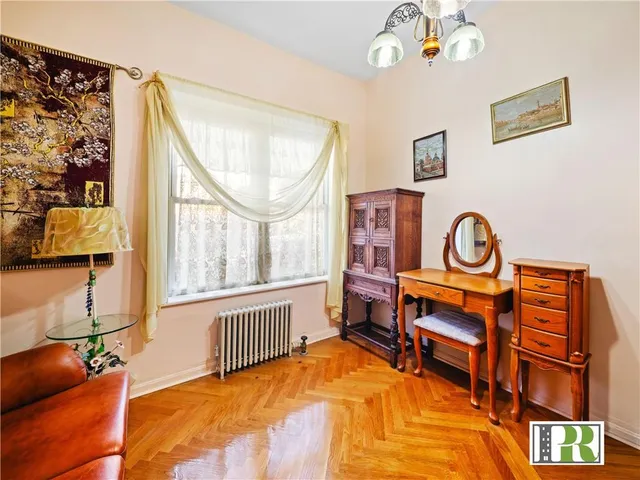 a bedroom with furniture and a window