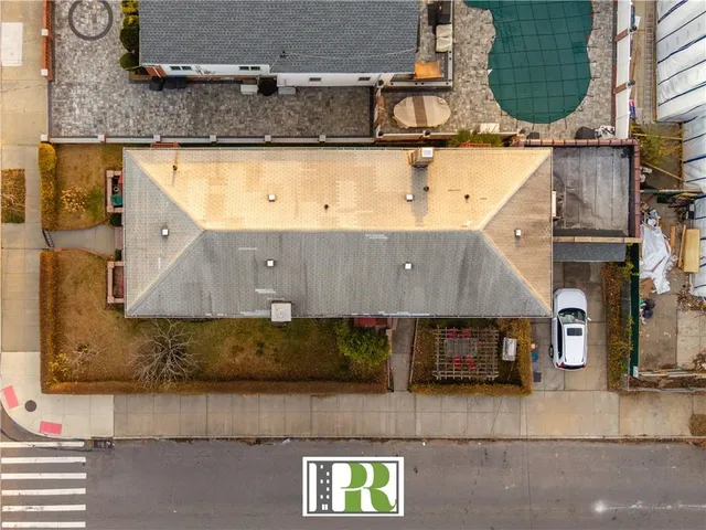 an aerial view of residential houses with outdoor space