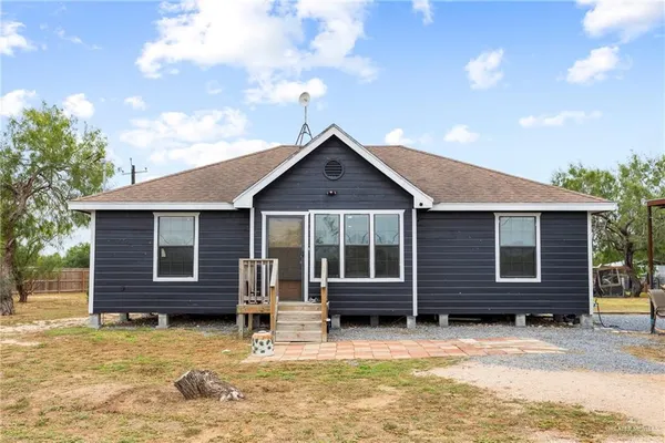 a front view of a house with a garage