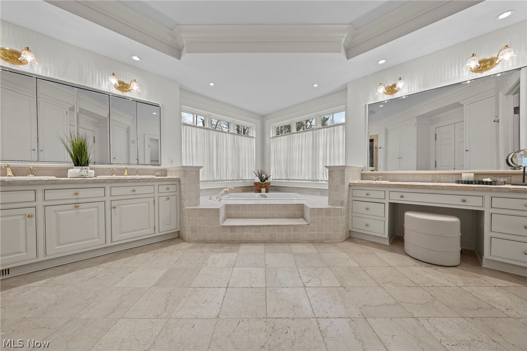 31900 Pinetree Road Pepper Pike, OH 44124 - Photo 24 of 43 With a stone floor and accents, the primary bath offers a double vanity, glass front shower and large tub. Sit down and pamper yourself.