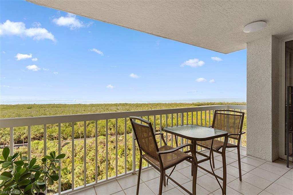 6573 Marissa Loop, Unit 1203 Naples, FL 34108 - Photo 12 of 22 a view of a balcony with chairs
