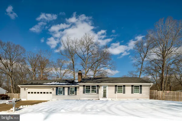 front view of a house with a dry yard