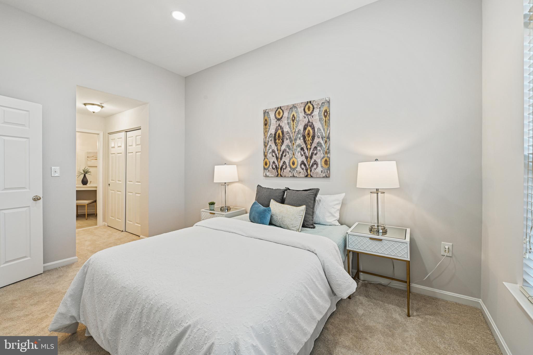 11400 Windleaf Court, Unit 41 Reston, VA 20194 - Photo 19 of 31 Hallway to Primary bathroom with 2 closets