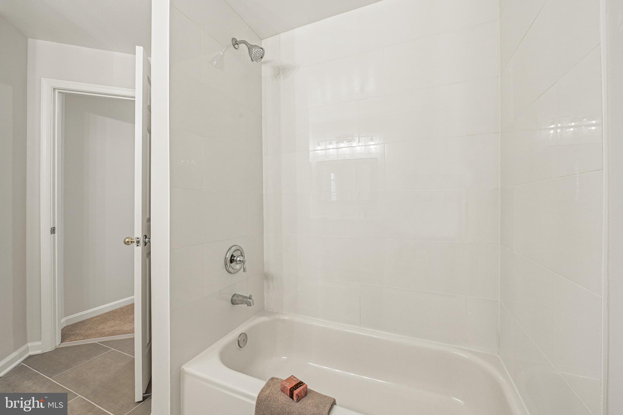 11400 Windleaf Court, Unit 41 Reston, VA 20194 - Photo 25 of 31 Hall Bath shower/tub combination with new tile