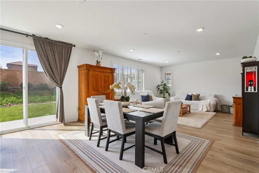 2464 Yellowstone Way Rialto, CA 92377 - Photo 13 of 75 a view of a dining room with furniture window and wooden floor