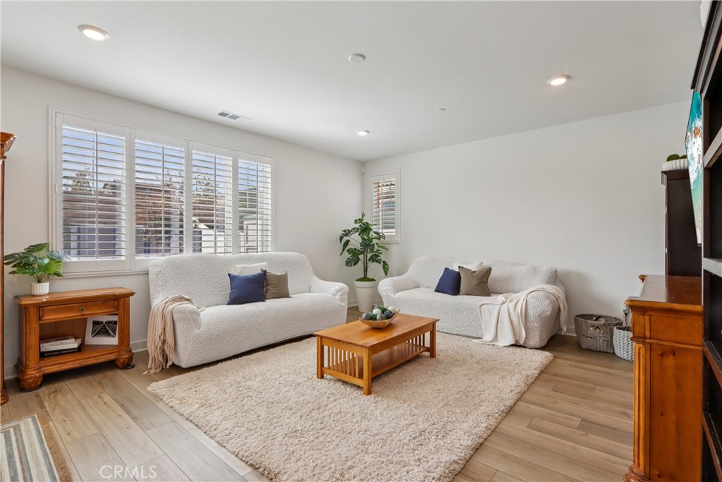 2464 Yellowstone Way Rialto, CA 92377 - Photo 17 of 75 a living room with furniture a window and a fireplace