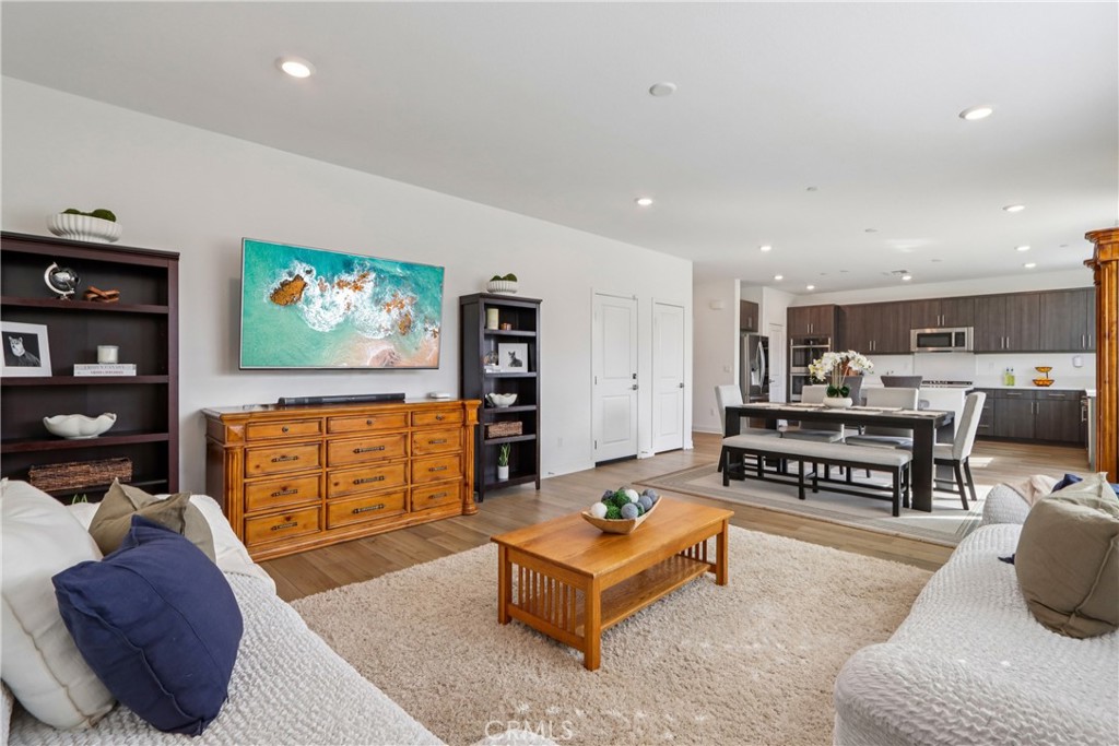 2464 Yellowstone Way Rialto, CA 92377 - Photo 19 of 75 a living room with furniture and a flat screen tv