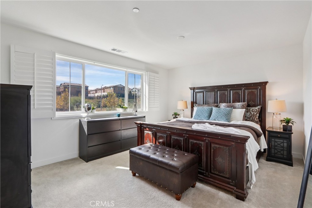 2464 Yellowstone Way Rialto, CA 92377 - Photo 28 of 75 a bed room with a bed and a window