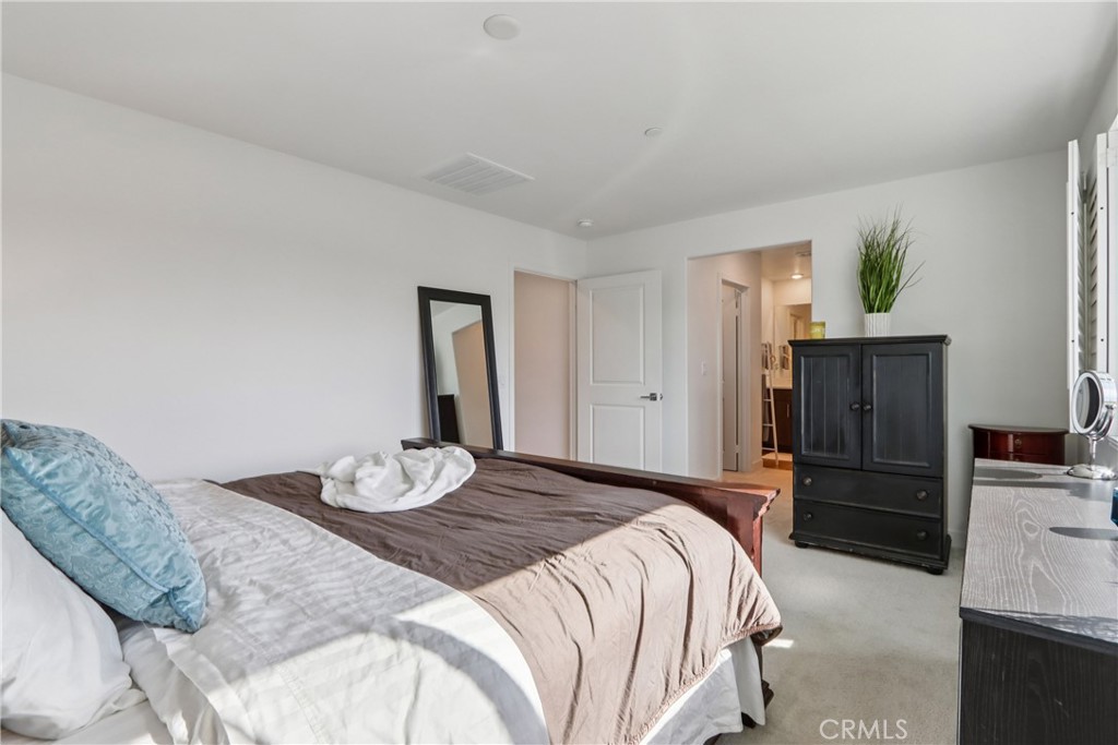 2464 Yellowstone Way Rialto, CA 92377 - Photo 30 of 75 a bedroom with a bed and a dresser