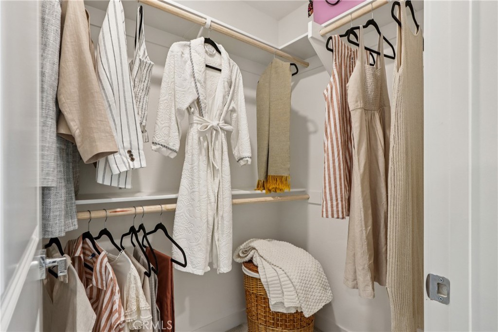 2464 Yellowstone Way Rialto, CA 92377 - Photo 33 of 75 a view of walk in closet with clothes and shoes