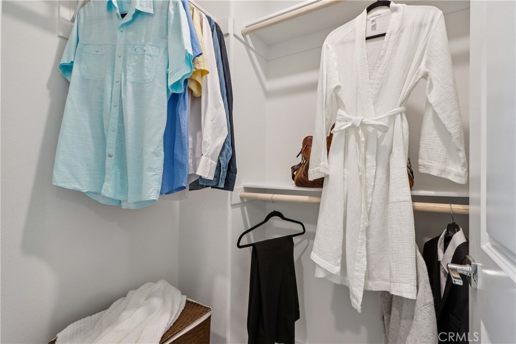 2464 Yellowstone Way Rialto, CA 92377 - Photo 34 of 75 a view of walk in closet with clothes and shoes